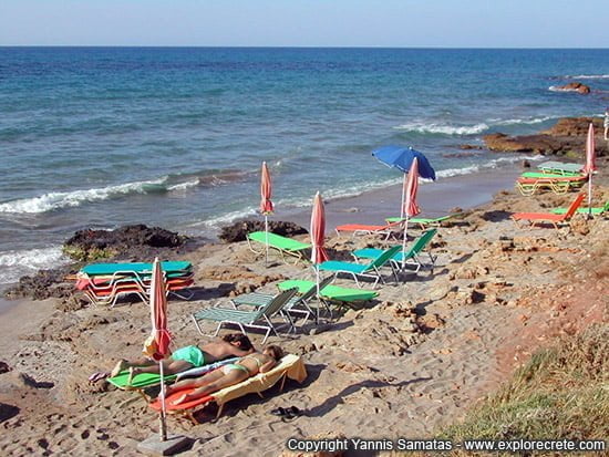 loungers on a rocky beach