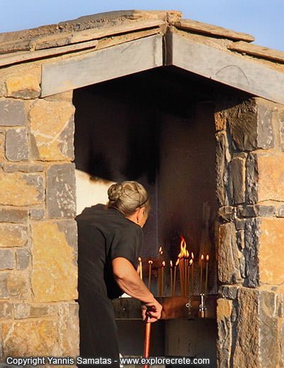 woman lighting candle