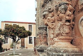 monsters carved in relief on the front of the church