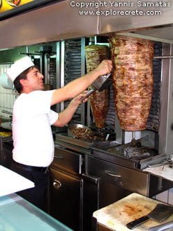 the cook slices the gyros