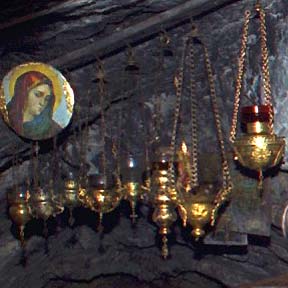 vigil candles with olive oil in church