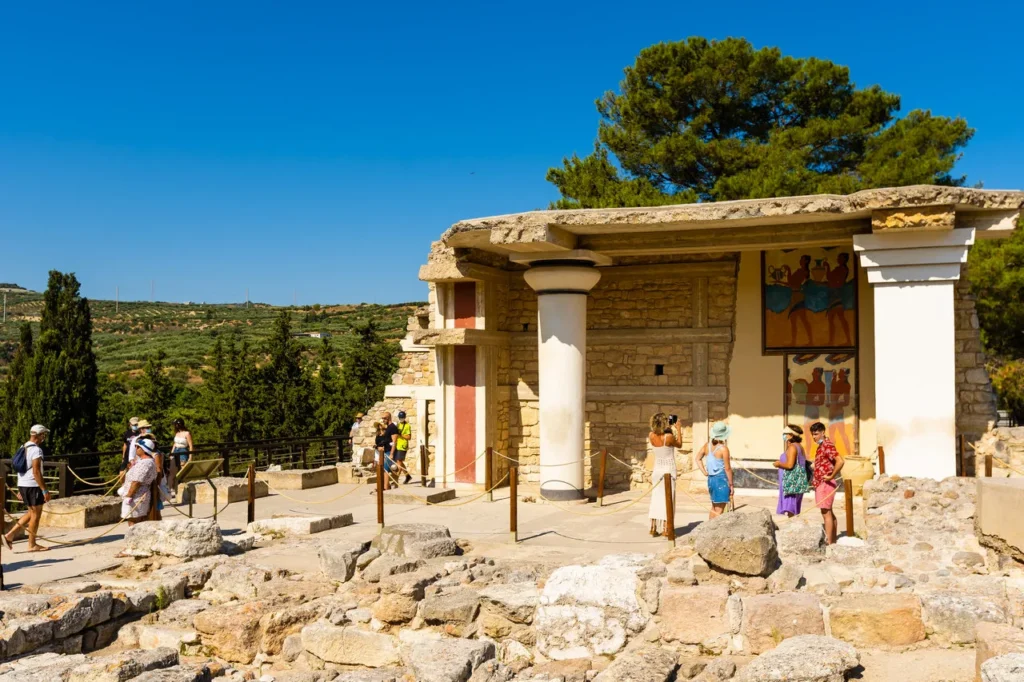 tourists at the minoan palace of knossos in crete